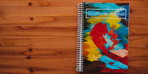 gratitude journal against wood background
